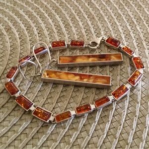 Silver bracelet and earrings. Looks like a set.